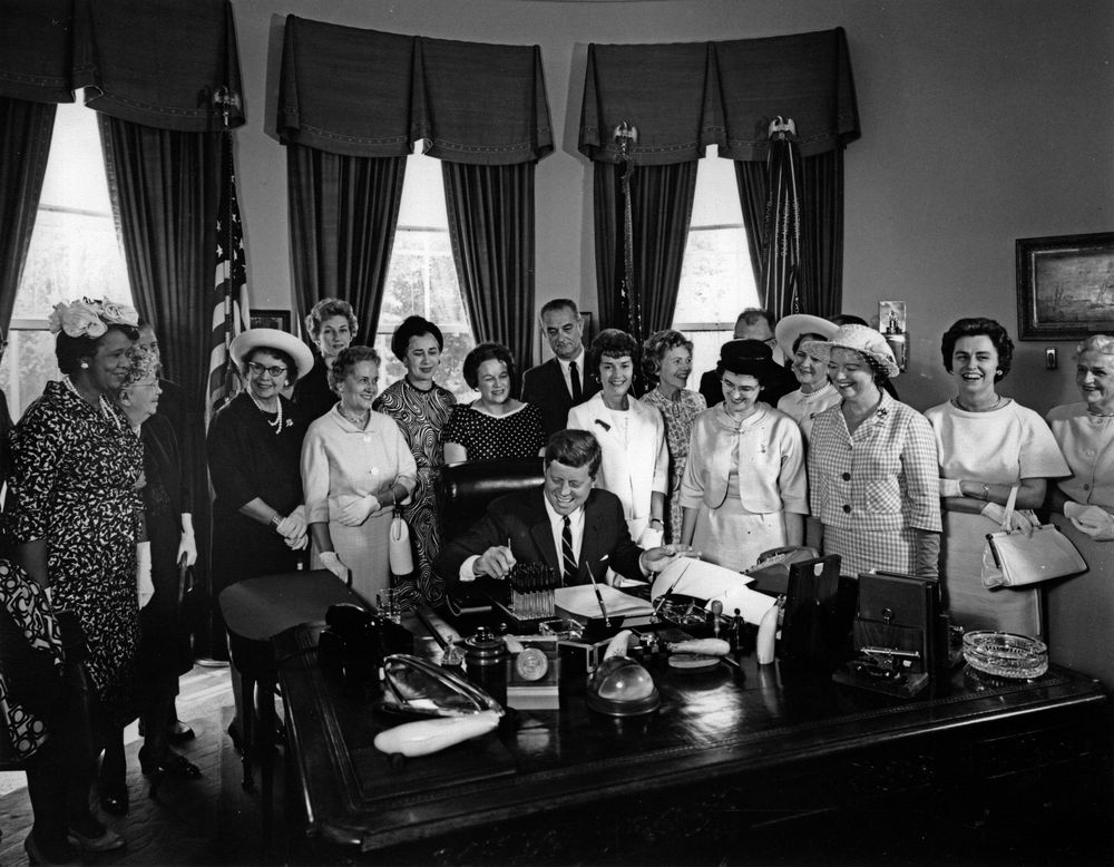 American_Association_of_University_Women_members_with_President_John_F._Kennedy_as_he_signs_the_Equal_Pay_Act_into_law.jpg