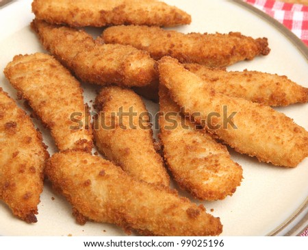 stock-photo-chicken-nuggets-or-goujons-shaped-chicken-in-breadcrumbs-99025196.jpg