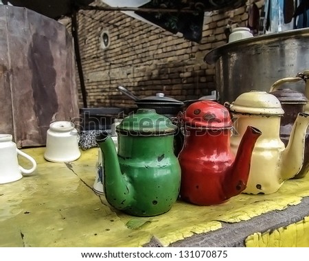 stock-photo-three-old-kettles-in-roadside-tea-shop-131070875.jpg