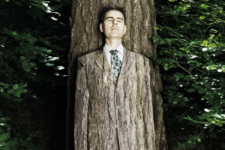 man-camouflaged-against-tree-bark.jpg