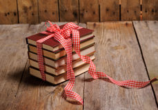 books-wrapped-color-ribbon-red-hearts-adn-snow-wooden-table-9761.jpg