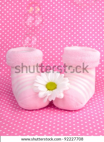 stock-photo-pink-baby-girl-knitted-socks-or-shoes-gift-for-newly-born-child-92227708.jpg