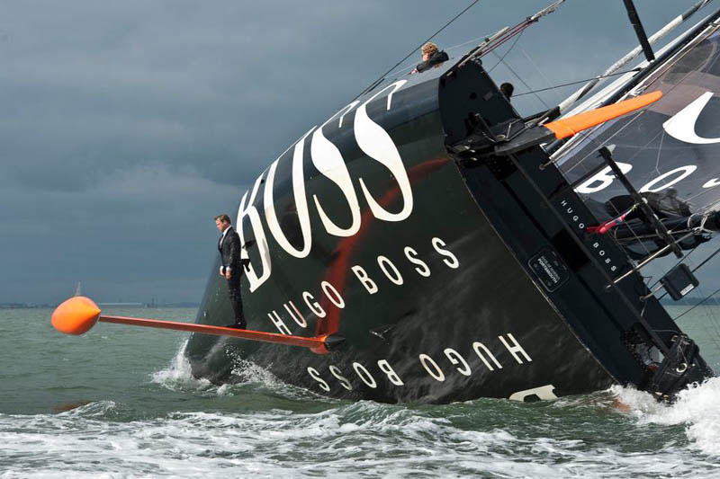 keel-walk-hugo-boss-suit-boat-sailing-standing-on-rutter.jpg