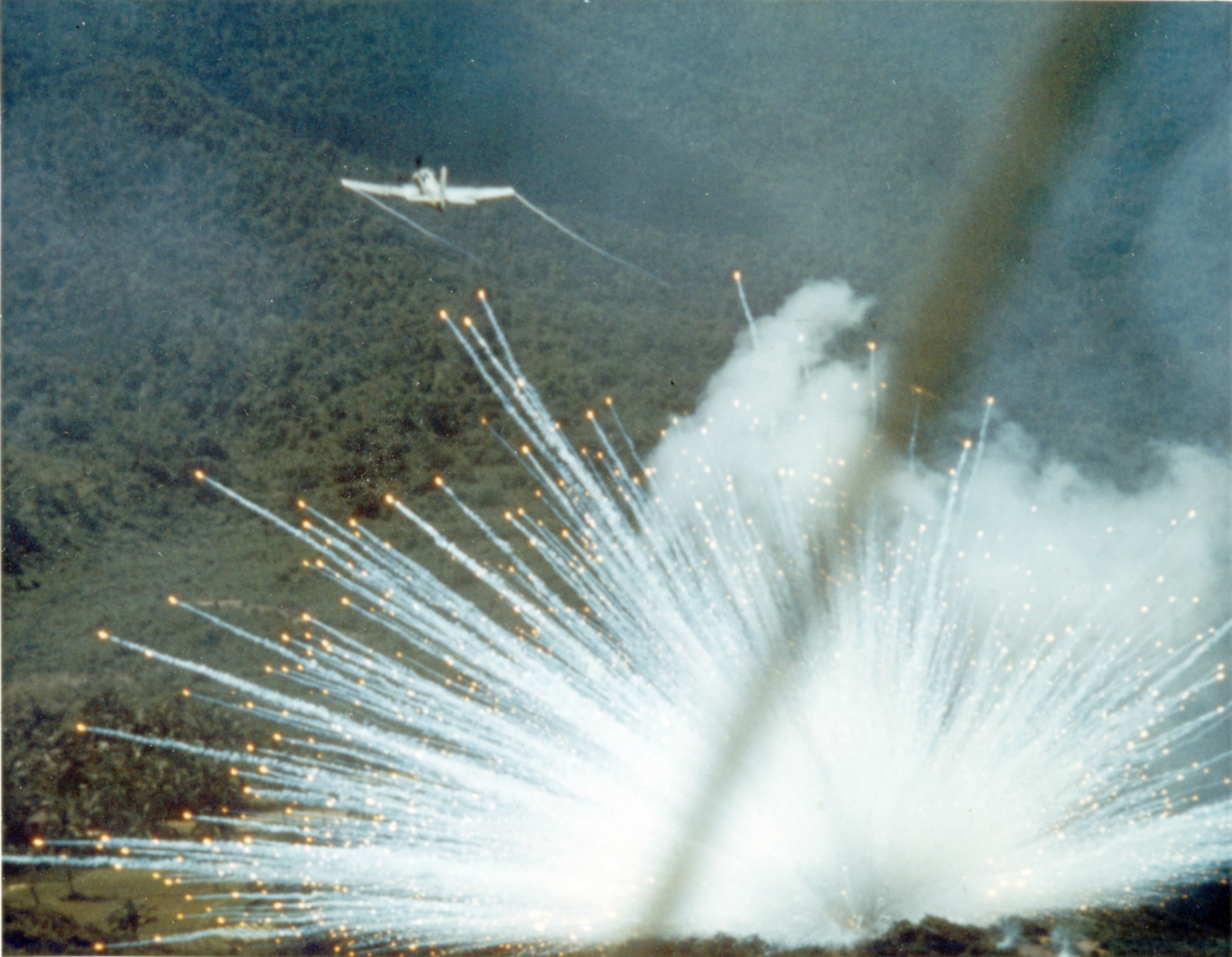 A-1E_drops_white_phosphorus_bomb_1966.jpg
