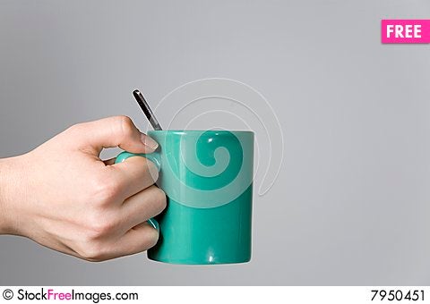 Woman-hand-holding-a-tea-cup-with-a-spoon-close-up-thumb7950451.jpg