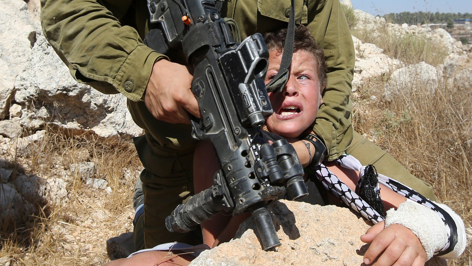 150830073831-01-israeli-soldier-arrests-palestinian-boy-super-tease.jpg