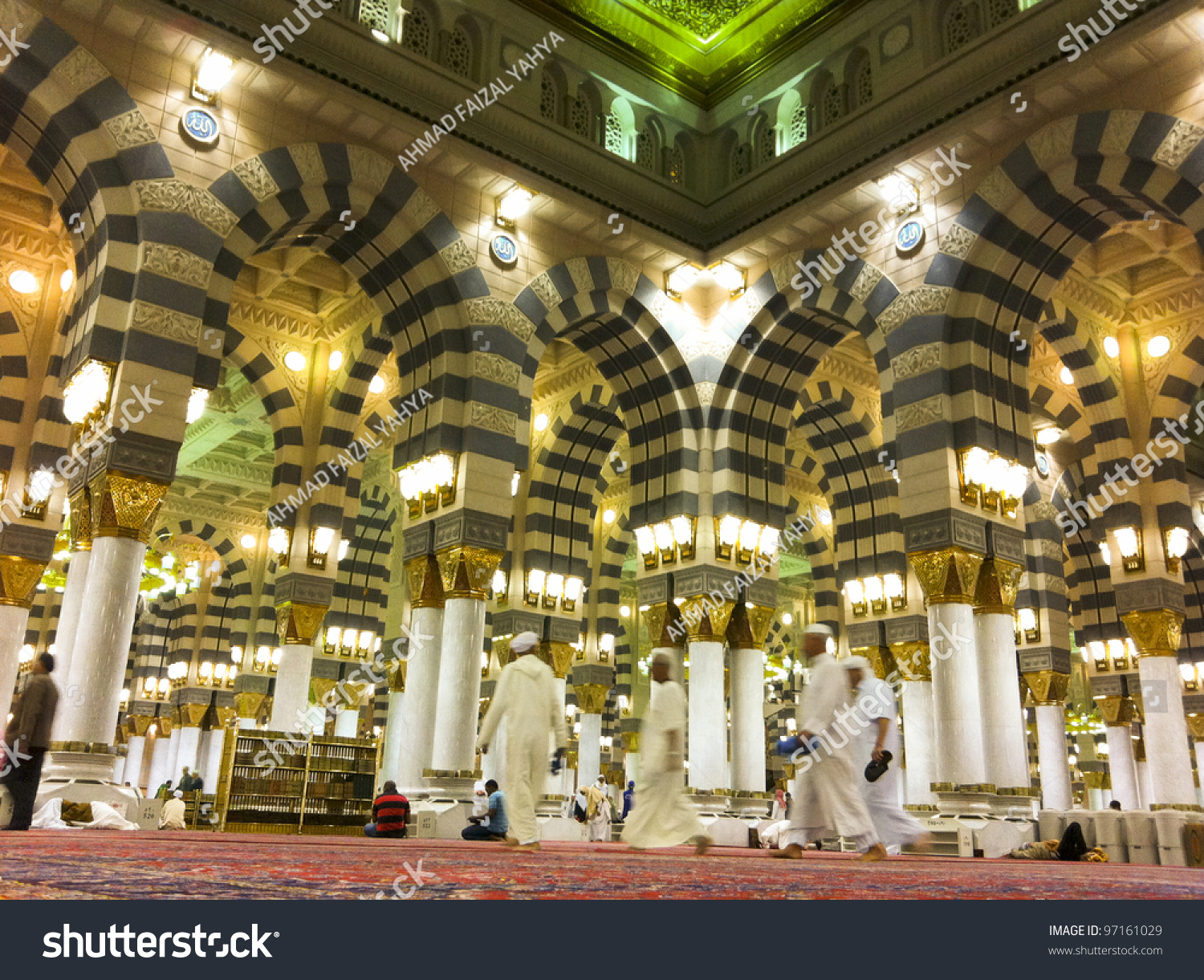 stock-photo-al-madinah-kingdom-of-saudi-arabia-feb-muslim-men-walk-on-inside-masjid-mosque-nabawi-on-97161029.jpg