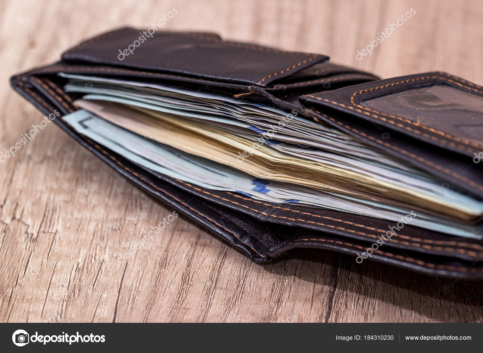 depositphotos_184310230-stock-photo-dollars-wallet-desk-close.jpg