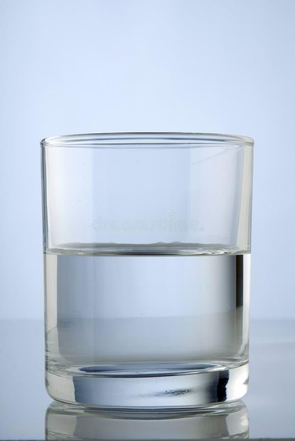 half-full-glass-water-front-blue-background-40319348.jpg